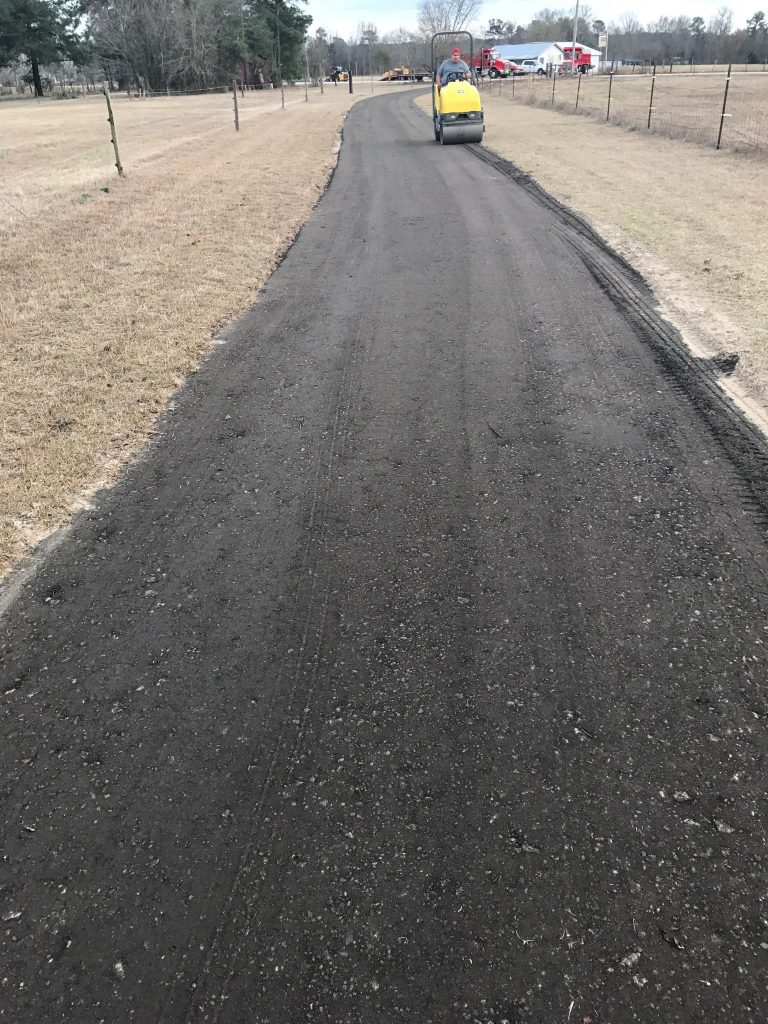 Freshly milled asphalt road compacted by roller